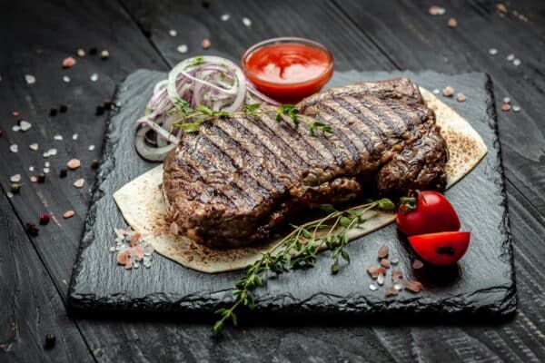 Grilled Steak on Wooden Board