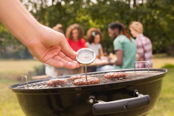 Friends grilling burgers