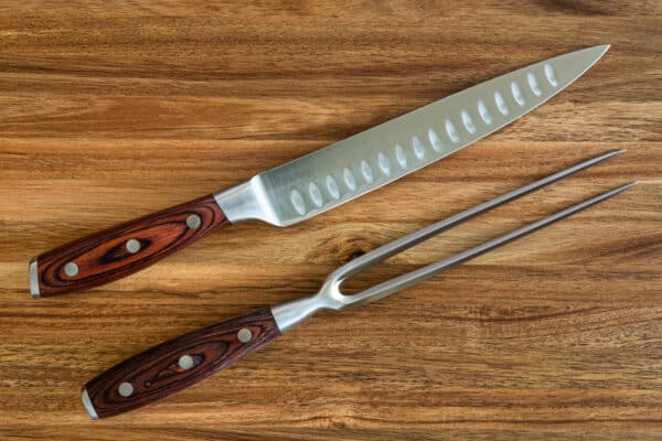 Knife and fork for slicing meat