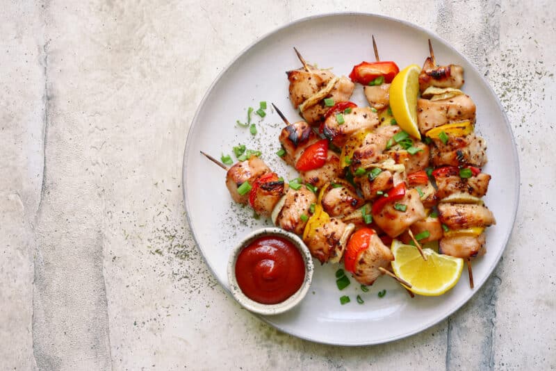 Chicken,Kebab,Skewers,On,A,Plate,Over,Light,Grey,Slate,